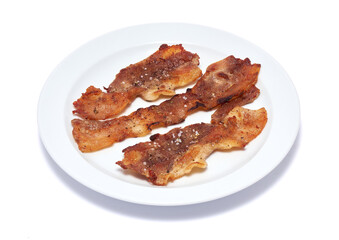 Cooked slices of bacon on white ceramic plate isolated on white background