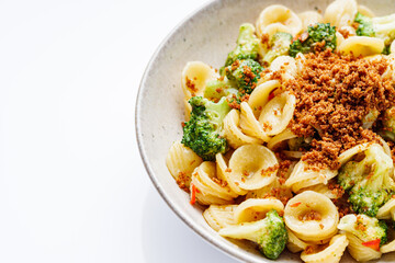 orequette pasta with broccoli on a white background
