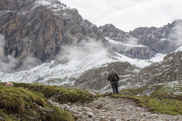 Obraz premium man trekking in the mountains, Alps in Austria, Lienzer Dolomiten, East Tyrol