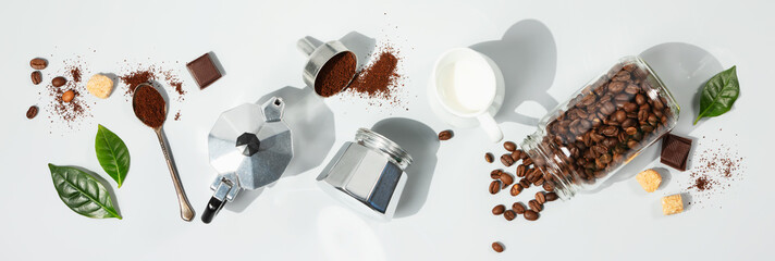 Coffee composition on light grey background with coffee arabica leaves, flat lay