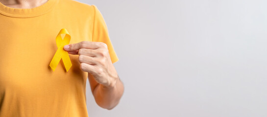 Suicide prevention day, Childhood, Sarcoma, bone and bladder cancer Awareness month, Yellow Ribbon for supporting people life and illness. Healthcare and World cancer day concept