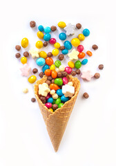 Ice cream waffle cone with candy isolated on white background.