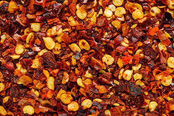 spicy chili flakes on a white background