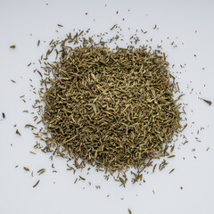 fragrant dried thyme on a white acrylic background