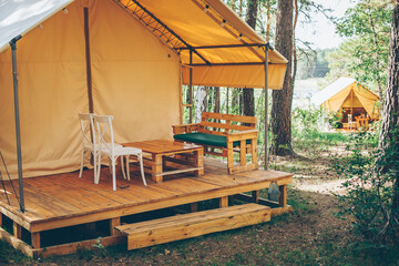 Path to glamping tent with view on woods. Camping and outdoor concept. Rest at nature