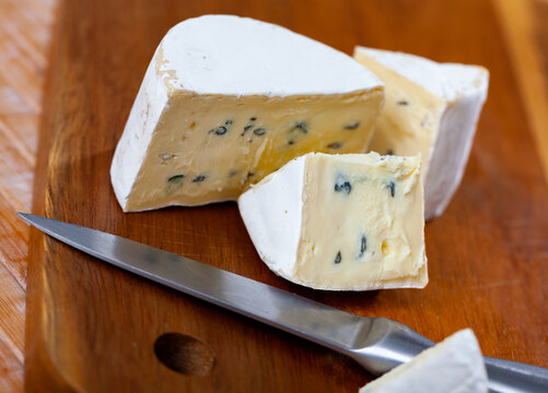 Appetizing Cheese Bavaria Blu, Cut Into Pieces, With White And Blue Noble Mold, Famous For Its Low Gluten And Lactose Content