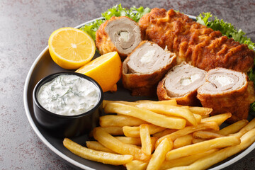 Karadjordjeva steak deep fried rolled veal or pork schnitzel served with fried potatoes with french...