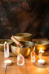 Still life with Tibetan singing bowls, minerals and candles.