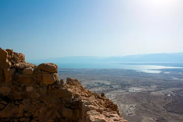 Foto op Plexiglas image of the Masada fortress against the backdrop of the Dead Sea © reznik_val