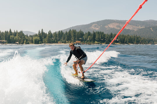 Man wakeboarding at lake