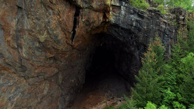 Ascending shot of Tonnes cave in Helgeland, cave in the mountain,  Northern Norway, Nordland