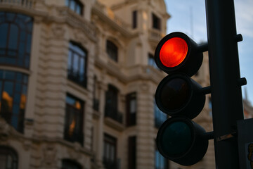 Red traffic light in the middle of a cross. Transportation industry.