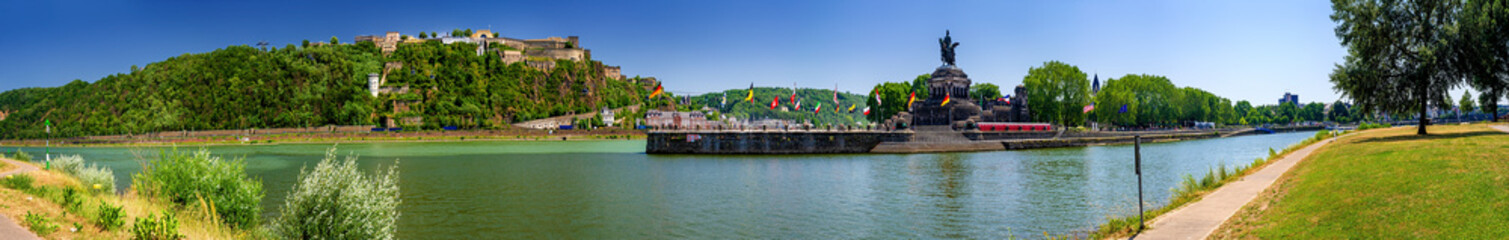 Fototapeta na wymiar German Corner (Deutsches Eck) in Koblenz at the confluence of Rhine and Moselle river with the monumental statue of William I and fortress Ehrenbreitstein in the state of Rhineland-Palatinate, Germany