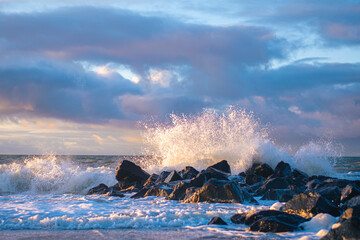 Wave crashing at rocks at danish coast. High quality photo - 515340113