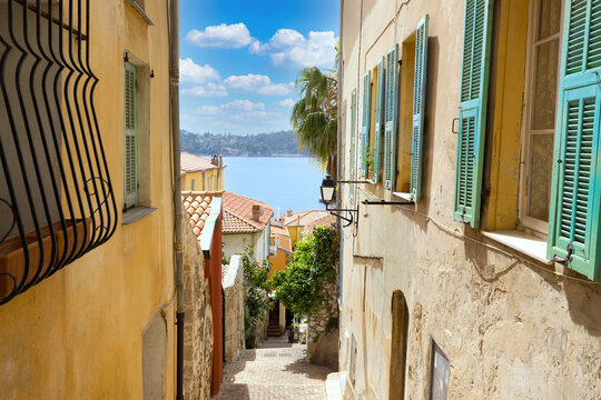 Fototapeta France, French Riviera, Villefranche old city streets in historic city center near sea promenade.