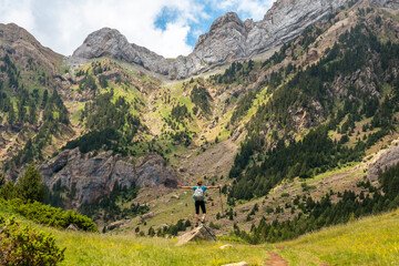 A hiker enjoying the mountain on vacation in the Pyrenees, Alto Gallego, Huesca, Aragon