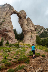 Fototapeta premium A young man at the Piedrafita arch in the Pyrenees in Biescas, Alto Gallego, Huesca province