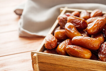 juicy royal dates on a wooden rustic background