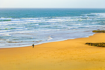 A fisherman heading  across his land