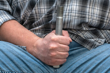 Close-up of a man with a tape measure. Sexual inferiority complex. Fear of failure in sex