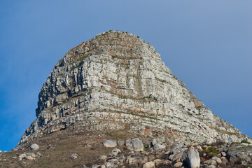 Fototapeta premium Copy space with scenic view of Lions Head mountain in Cape Town South Africa against a clear blue sky background from below. Beautiful panoramic of an iconic landmark and famous travel destination