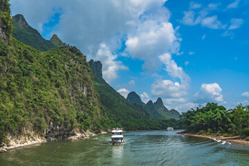 Fototapeta na wymiar Tourist boat sailing on a Li River in China