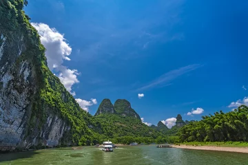 Wanddecoratie Guilin Tourist boat sailing on a Li River in China  © Pav-Pro Photography 