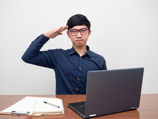 Young man glasses respect hand at eyebrow for acknowledge working white background