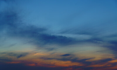 Naklejka na ściany i meble beautiful sunset sky, dark colorful clouds as abstract background