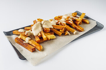 golden french fries on a white acrylic background