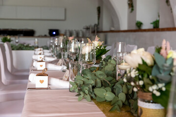 festive decorated table with glasses and flowers at a celebration