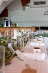 festive decorated table with glasses and flowers at a celebration