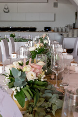 festive decorated table with glasses and flowers at a celebration