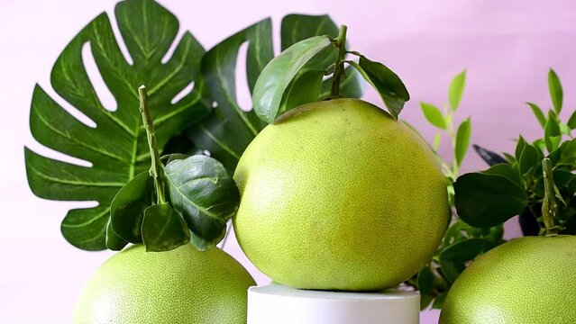 A large tropical fruit grapefruit on a video spindle.