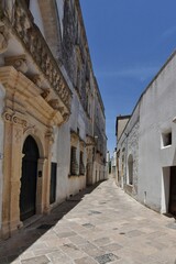 Fototapeta na wymiar A street in the historic center of Specchia, a medieval town in the Puglia region, Italy.