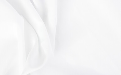 Smooth elegant white silk or elegant satin texture can be used as background.