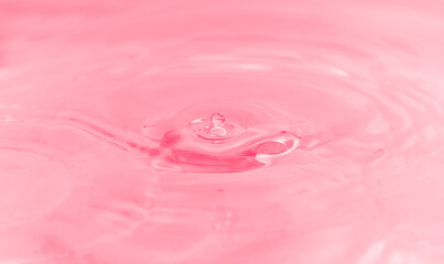 water drop, bubbles and water ripples on  pale pink  light effects background. 
