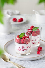 Glasses with yogurt and raspberry dessert