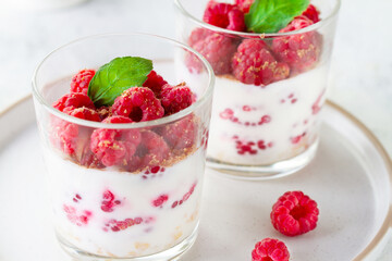 Yogurt with raspberries in a glass
