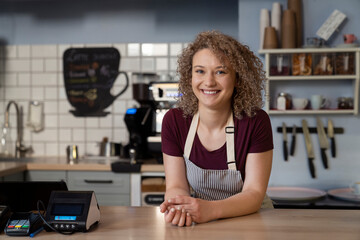 Portrait of young caucasian woman in the cafe