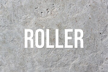 ROLLER - word on concrete background. Cement floor, wall.