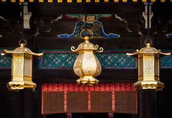 Architectural details with golden lanterns at the Poet's Festival, Kitano Tenmangu Sanctuary in Kyoto Japan.