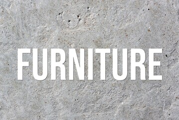 FURNITURE - word on concrete background. Cement floor, wall.