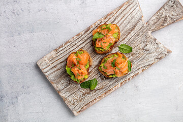 Salmon avocado keto sandwiches on healthy seed buns.