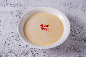 cheese soup. on a light concrete background