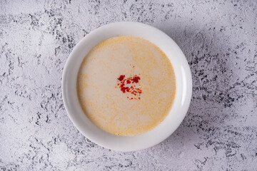 cheese soup. on a light concrete background
