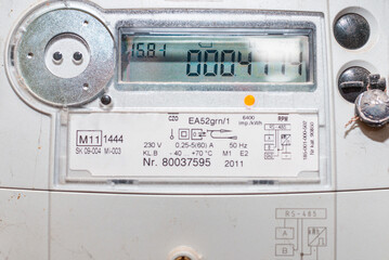 Fototapeta premium smart electric power meter counter measuring power usage.Close-up of modern smart grid residential digital power supply meter.Indoors shot.Selective focus.