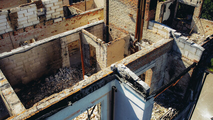 a house in Irpen destroyed by shells of Russian occupiers, drone view