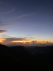 View from the top of the mountain with beautiful clouds and sunshine