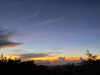 View from the top of the mountain with beautiful clouds and sunshine